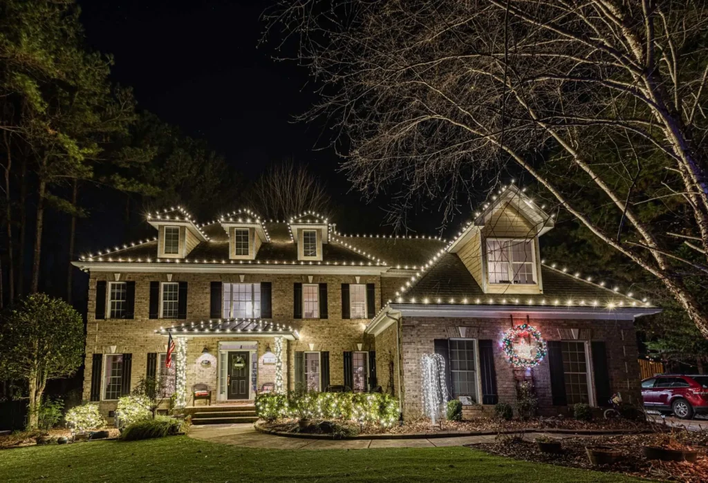 Warm white holiday lights installed on a traditional Atlanta-area home.