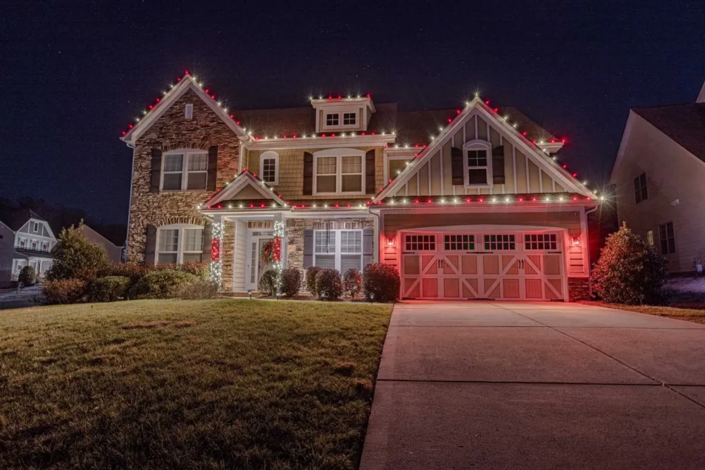 Fulton County home decorated with coordinated red and white Christmas lights