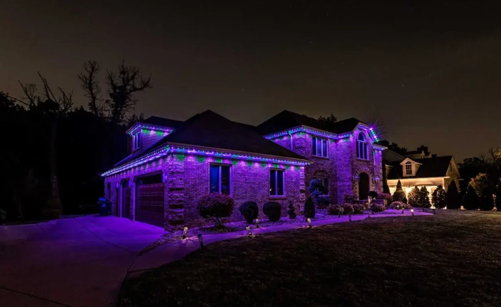 Purple permanent-style multicolor lights illuminating an Atlanta-area home.